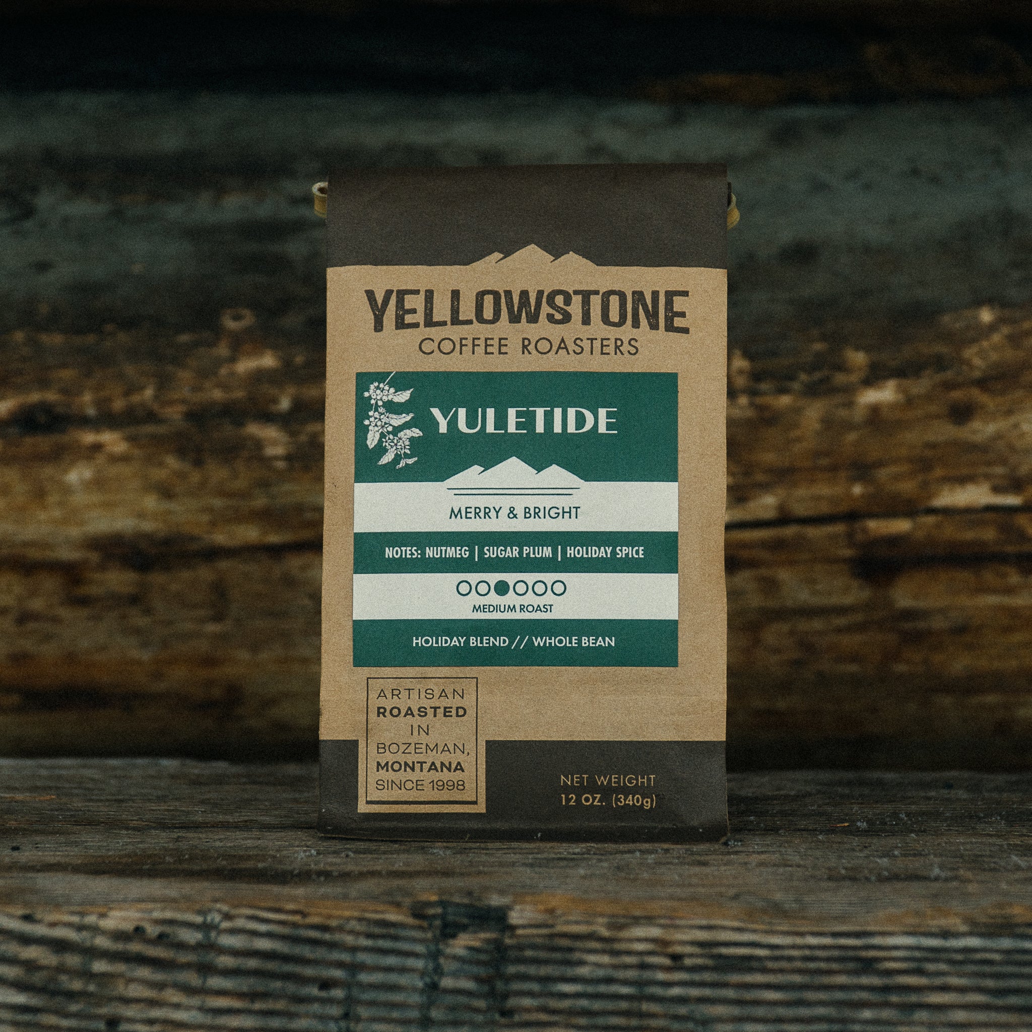 Yuletide holiday coffee blend outside a Montana log cabin.